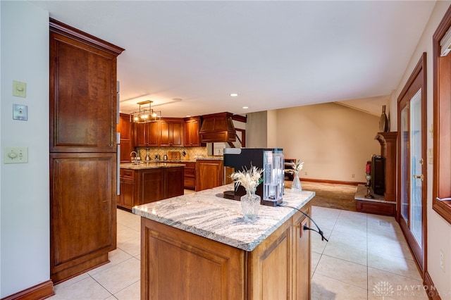 1211 Runnymede Rd, Oakwood, OH 45419 - kitchen featuring a center island with sink, light tile patterned floors, custom exhaust hood, baseboards, and recessed lighting
