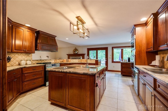 1211 Runnymede Rd, Oakwood, OH 45419 - kitchen with stainless steel appliances, a sink, premium range hood, tasteful backsplash, and recessed lighting