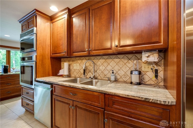 1211 Runnymede Rd, Oakwood, OH 45419 - kitchen with appliances with stainless steel finishes, a sink, and brown cabinets