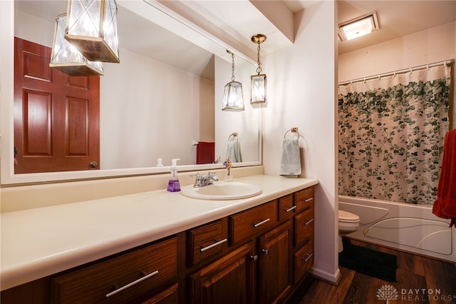 1211 Runnymede Rd, Oakwood, OH 45419 - full bathroom with vanity, wood finished floors, toilet, and shower / tub combo with curtain