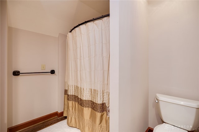 1211 Runnymede Rd, Oakwood, OH 45419 - bathroom with toilet and a shower with shower curtain
