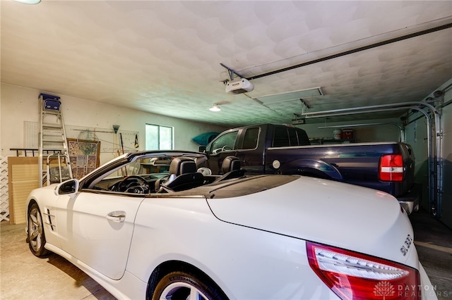 1211 Runnymede Rd, Oakwood, OH 45419 - garage featuring a garage door opener
