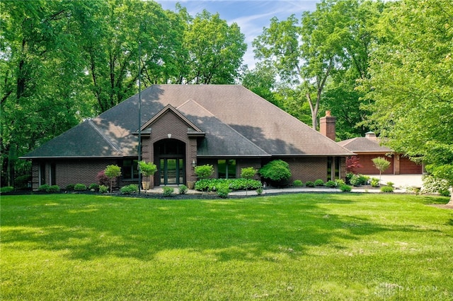 1211 Runnymede Rd, Oakwood, OH 45419 - view of front facade with a front lawn, brick siding, and a chimney