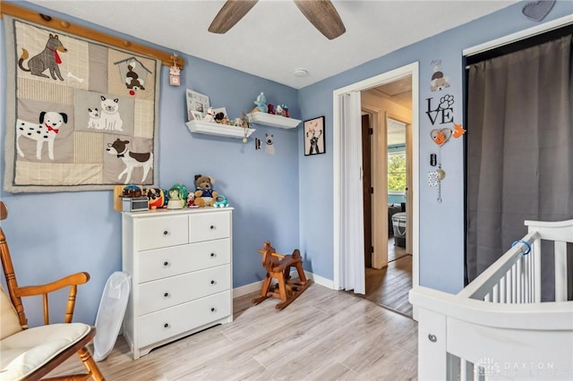813 Ridge Rd, Englewood, OH 45322 - bedroom with light wood-style flooring, ceiling fan, and baseboards