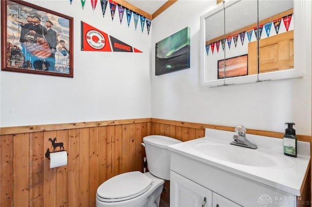 813 Ridge Rd, Englewood, OH 45322 - bathroom with vanity, toilet, wainscoting, and wood walls