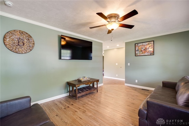 613 Spinning Rd, New Carlisle, OH 45344 - living room with ceiling fan, ornamental molding, light wood-type flooring, baseboards, and recessed lighting