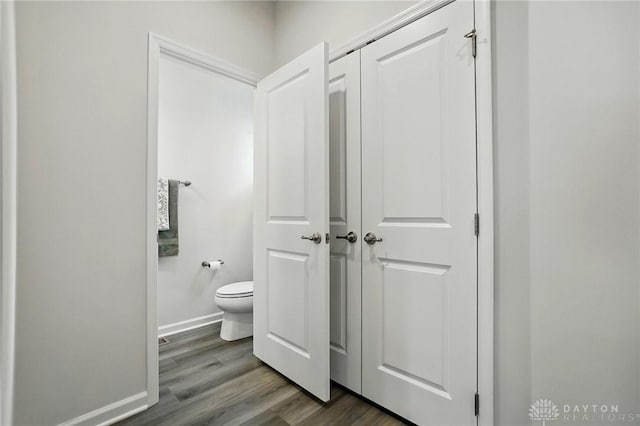 2550 Bellevue Dr, Batavia, OH 45103 - bathroom featuring toilet, wood finished floors, and baseboards