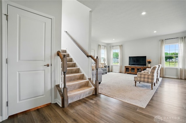 2550 Bellevue Dr, Batavia, OH 45103 - living area with plenty of natural light, stairway, dark wood-style floors, and recessed lighting