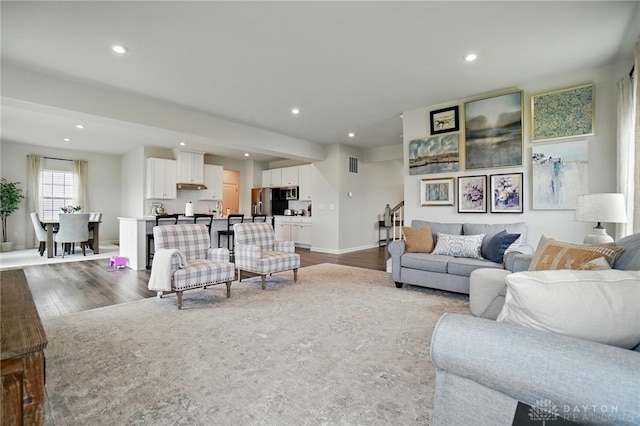 2550 Bellevue Dr, Batavia, OH 45103 - living area featuring wood finished floors, recessed lighting, and baseboards