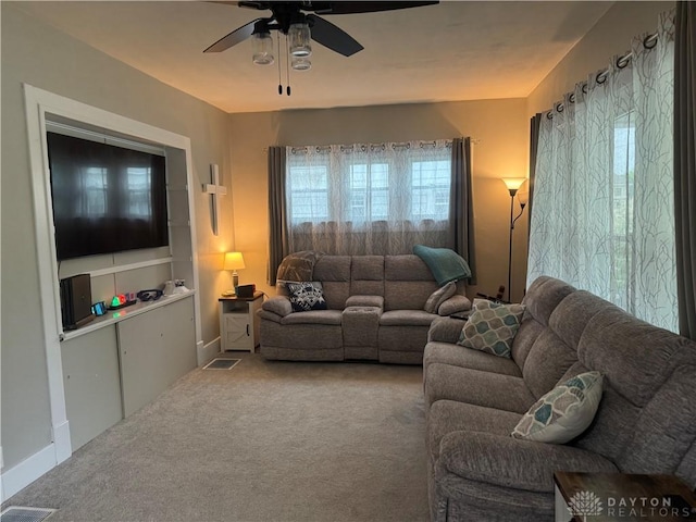 224 S Wolf Creek St, Brookville, OH 45309 - carpeted living room with a ceiling fan and healthy amount of natural light