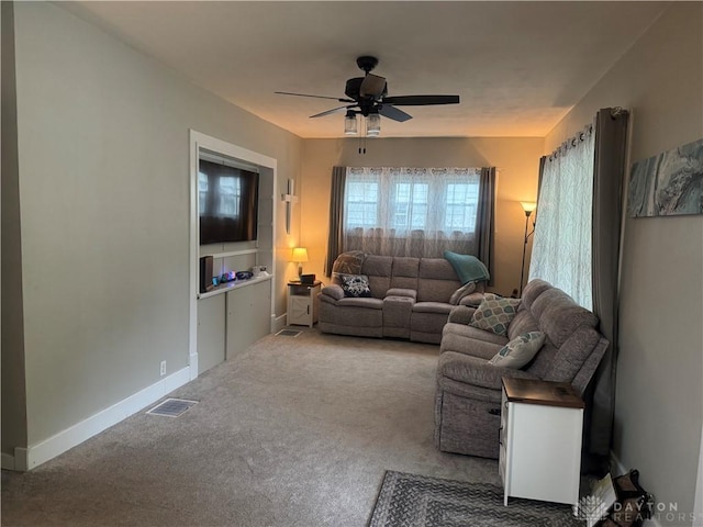 224 S Wolf Creek St, Brookville, OH 45309 - carpeted living area with ceiling fan and baseboards