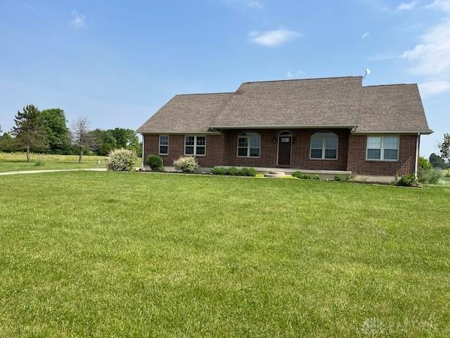 5671 Sonora Rd, Lewisburg, OH 45338 - view of front of home with a front yard and brick siding