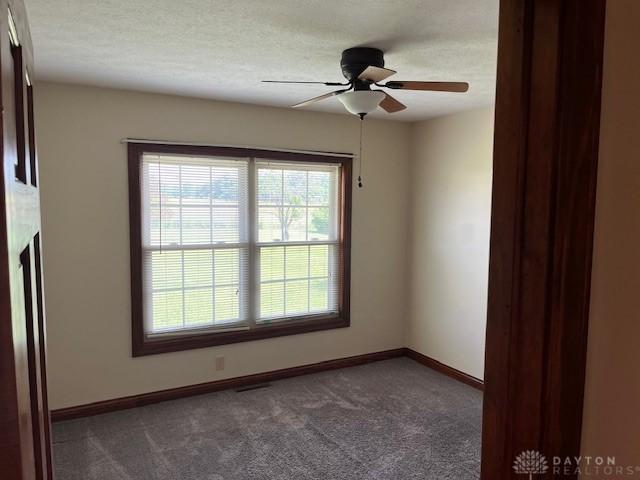 5671 Sonora Rd, Lewisburg, OH 45338 - empty room featuring carpet, a ceiling fan, and baseboards