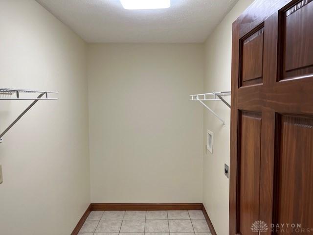 5671 Sonora Rd, Lewisburg, OH 45338 - spacious closet featuring light tile patterned floors