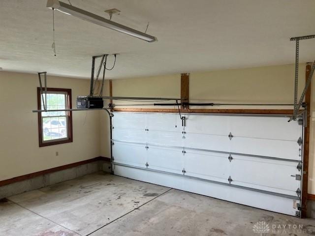 5671 Sonora Rd, Lewisburg, OH 45338 - garage featuring baseboards