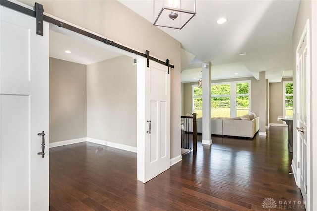 5411 Whispering Brook Ct, Liberty Twp, OH 45011 - unfurnished room with a barn door, dark wood-style flooring, baseboards, and recessed lighting