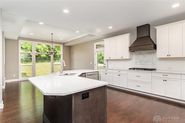 5411 Whispering Brook Ct, Liberty Twp, OH 45011 - kitchen featuring premium range hood, a sink, dark wood finished floors, light countertops, and recessed lighting