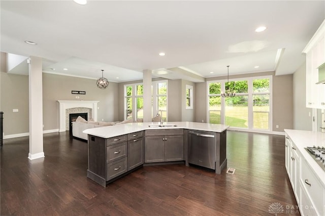 5411 Whispering Brook Ct, Liberty Twp, OH 45011 - kitchen featuring stainless steel dishwasher, a sink, open floor plan, light countertops, and recessed lighting