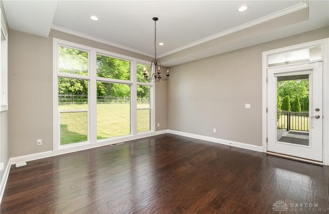 5411 Whispering Brook Ct, Liberty Twp, OH 45011 - unfurnished dining area featuring plenty of natural light, a chandelier, dark wood-type flooring, baseboards, and ornamental molding