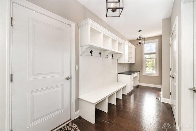 5411 Whispering Brook Ct, Liberty Twp, OH 45011 - mudroom featuring a chandelier, dark wood-style flooring, and baseboards