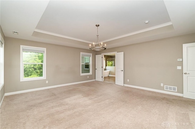 5411 Whispering Brook Ct, Liberty Twp, OH 45011 - unfurnished room with a tray ceiling, a chandelier, crown molding, light carpet, and baseboards