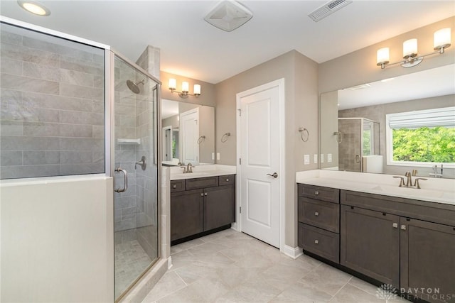 5411 Whispering Brook Ct, Liberty Twp, OH 45011 - bathroom with a shower stall, two vanities, and baseboards