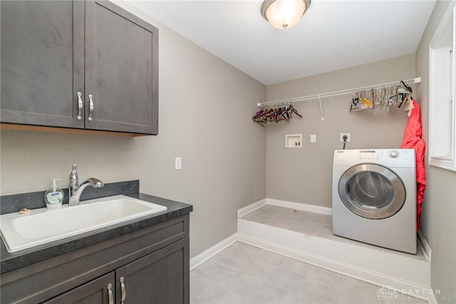 5411 Whispering Brook Ct, Liberty Twp, OH 45011 - laundry area with washer / dryer, cabinet space, and baseboards