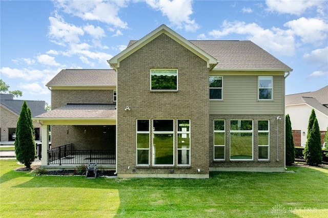 5411 Whispering Brook Ct, Liberty Twp, OH 45011 - rear view of house featuring brick siding and a lawn