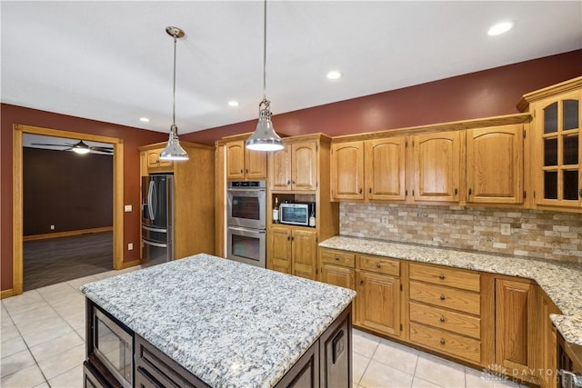 4384 New Market Banta Rd, Lewisburg, OH 45338 - kitchen featuring appliances with stainless steel finishes, backsplash, light tile patterned flooring, glass insert cabinets, and light stone counters