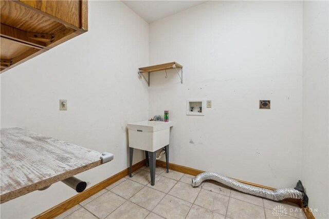 4384 New Market Banta Rd, Lewisburg, OH 45338 - washroom with electric dryer hookup, hookup for a washing machine, baseboards, and light tile patterned floors