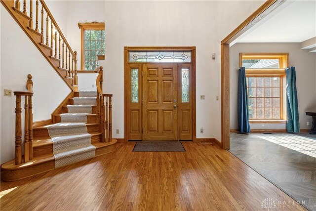 4384 New Market Banta Rd, Lewisburg, OH 45338 - foyer with a towering ceiling, stairs, wood finished floors, and baseboards