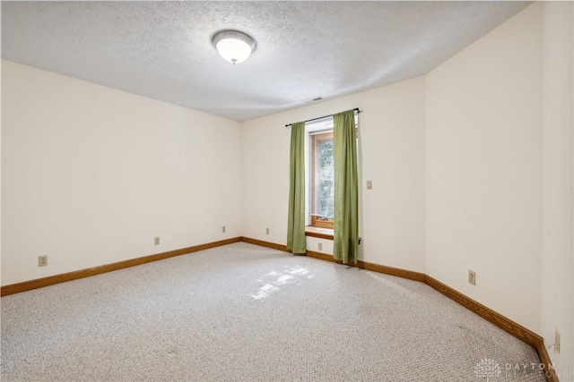 4384 New Market Banta Rd, Lewisburg, OH 45338 - unfurnished room featuring light carpet, baseboards, and a textured ceiling