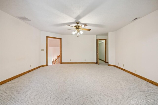 4384 New Market Banta Rd, Lewisburg, OH 45338 - empty room with light colored carpet, baseboards, and a ceiling fan