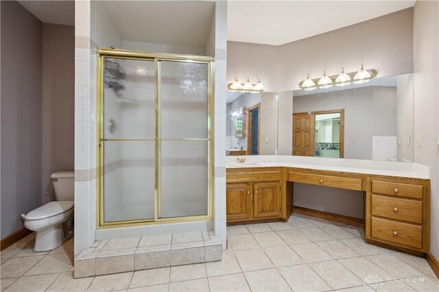 4384 New Market Banta Rd, Lewisburg, OH 45338 - bathroom featuring toilet, a stall shower, vanity, and tile patterned flooring