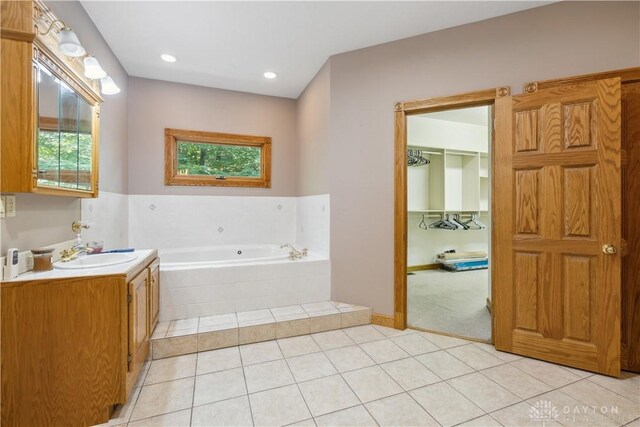 4384 New Market Banta Rd, Lewisburg, OH 45338 - full bath featuring a garden tub, vanity, plenty of natural light, tile patterned flooring, and recessed lighting