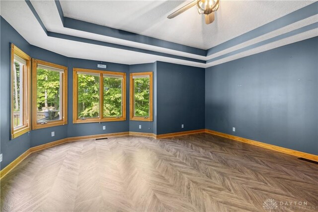 4384 New Market Banta Rd, Lewisburg, OH 45338 - empty room with baseboards, a ceiling fan, and a tray ceiling