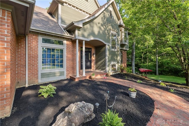 4384 New Market Banta Rd, Lewisburg, OH 45338 - property entrance with brick siding and a shingled roof