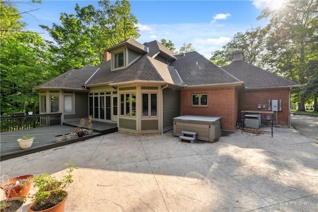 4384 New Market Banta Rd, Lewisburg, OH 45338 - back of house featuring a hot tub, a patio, roof with shingles, and a deck