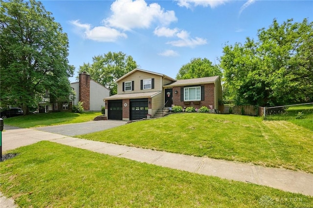 9675 Pellston Way, Miamisburg, OH 45342 - split level home with a garage, driveway, and brick siding
