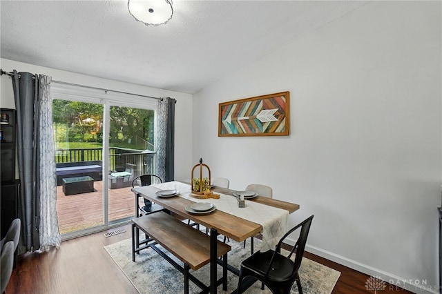 9675 Pellston Way, Miamisburg, OH 45342 - dining area featuring lofted ceiling, wood finished floors, and baseboards