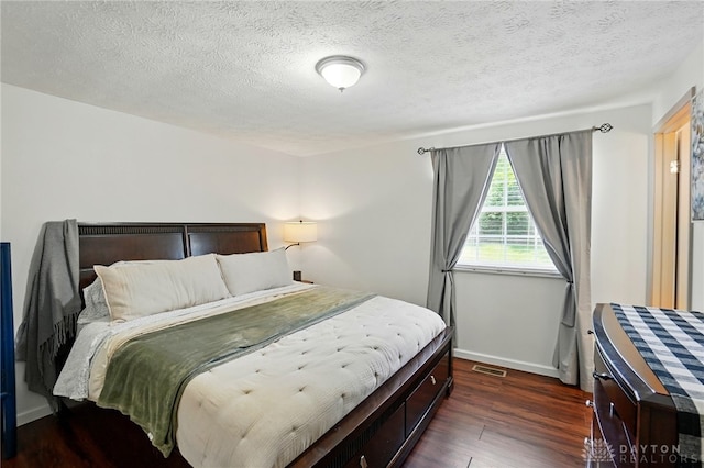 9675 Pellston Way, Miamisburg, OH 45342 - bedroom featuring dark wood-style floors, baseboards, and a textured ceiling