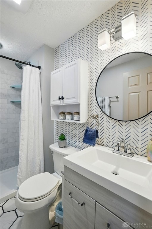 9675 Pellston Way, Miamisburg, OH 45342 - bathroom with toilet, vanity, a textured ceiling, a tile shower, and tasteful backsplash