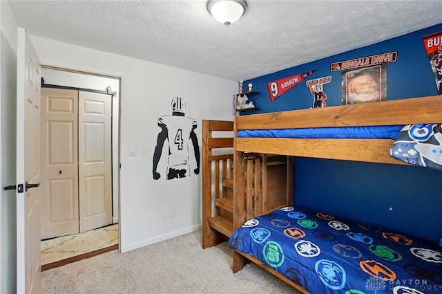 9675 Pellston Way, Miamisburg, OH 45342 - bedroom with carpet flooring, a textured ceiling, and baseboards