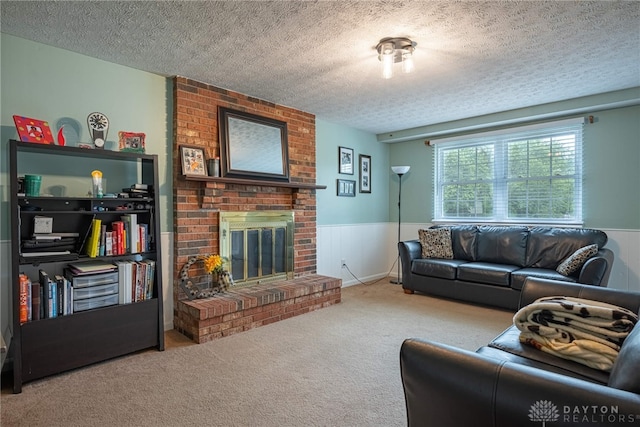 2547 Ryan Ct, Beavercreek, OH 45434 - living room with a wainscoted wall, carpet floors, a fireplace, and a textured ceiling