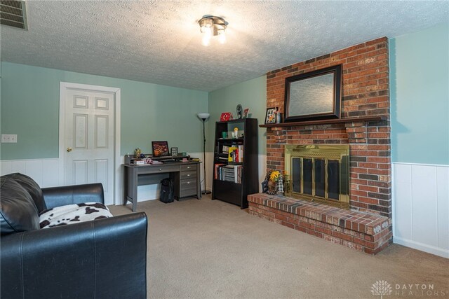 2547 Ryan Ct, Beavercreek, OH 45434 - living area with a textured ceiling, wainscoting, carpet floors, and a brick fireplace