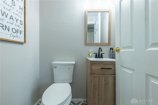 2547 Ryan Ct, Beavercreek, OH 45434 - bathroom with vanity, toilet, and baseboards