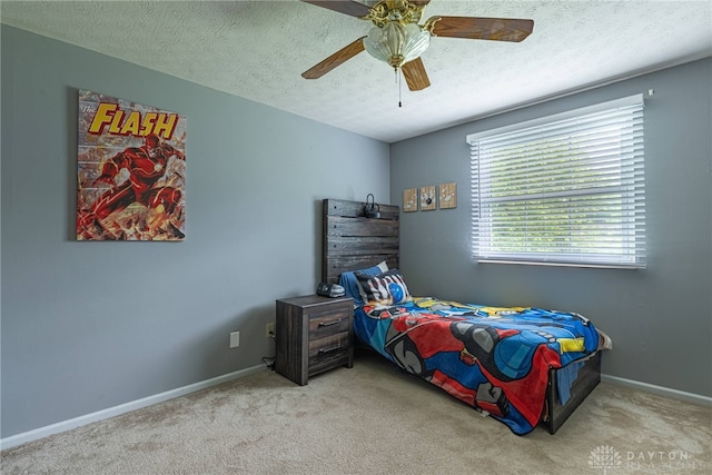 2547 Ryan Ct, Beavercreek, OH 45434 - bedroom with carpet, a textured ceiling, baseboards, and a ceiling fan