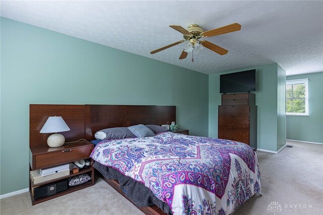 2547 Ryan Ct, Beavercreek, OH 45434 - bedroom featuring carpet, baseboards, a ceiling fan, and a textured ceiling