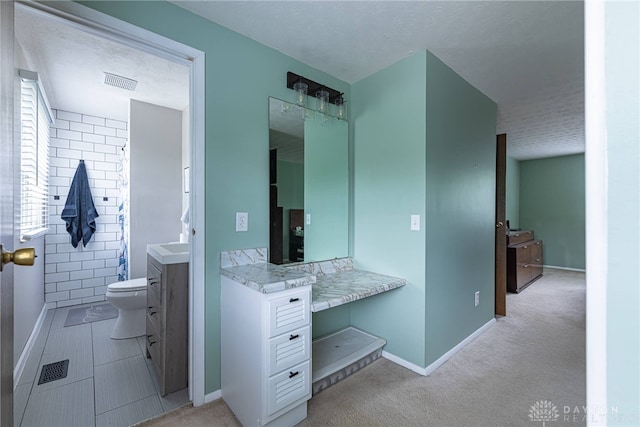 2547 Ryan Ct, Beavercreek, OH 45434 - bathroom featuring vanity, toilet, baseboards, and a textured ceiling