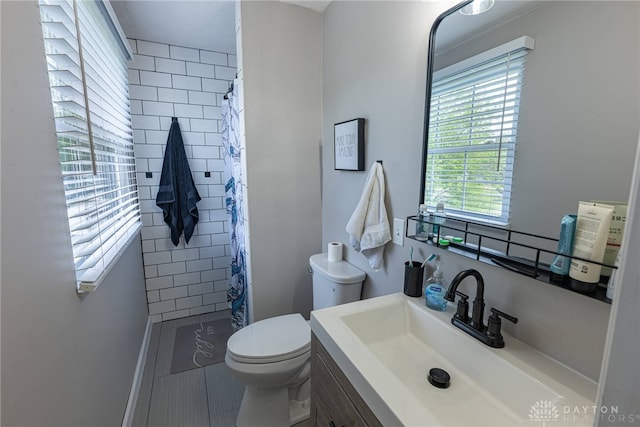 2547 Ryan Ct, Beavercreek, OH 45434 - full bath with toilet, a tile shower, and vanity